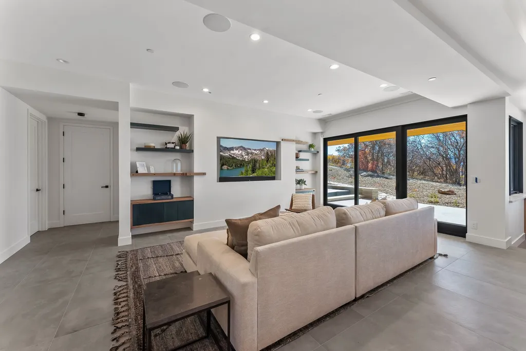 2409 Preserve Drive Home in Park City, Utah. Discover this stunning 6-bedroom, 8-bathroom, 9,196 sq. ft. contemporary home in The Preserve, a premier gated community. Perched on 9.07 acres at the mountain's summit, the home offers breathtaking 280-degree views of ski areas, the Olympic Park, and Salt Lake City.