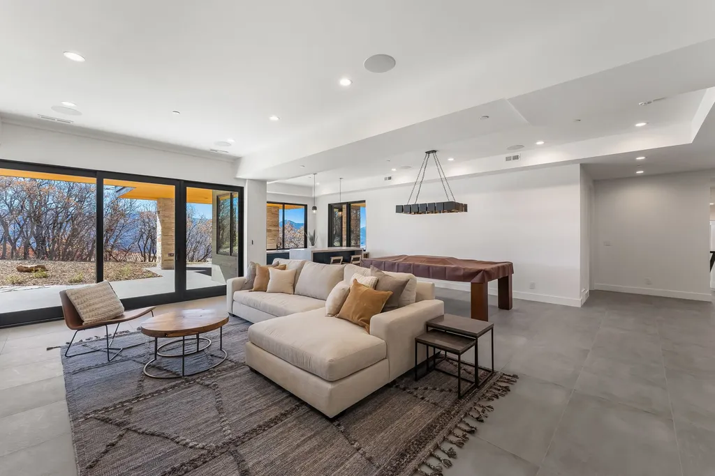 2409 Preserve Drive Home in Park City, Utah. Discover this stunning 6-bedroom, 8-bathroom, 9,196 sq. ft. contemporary home in The Preserve, a premier gated community. Perched on 9.07 acres at the mountain's summit, the home offers breathtaking 280-degree views of ski areas, the Olympic Park, and Salt Lake City.