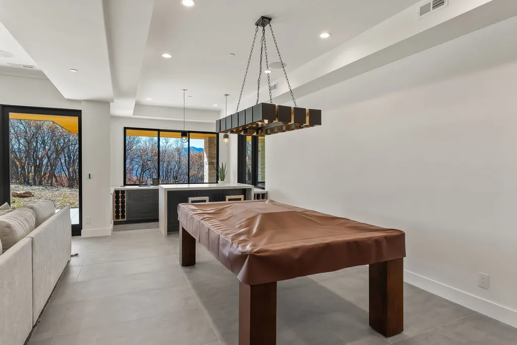 2409 Preserve Drive Home in Park City, Utah. Discover this stunning 6-bedroom, 8-bathroom, 9,196 sq. ft. contemporary home in The Preserve, a premier gated community. Perched on 9.07 acres at the mountain's summit, the home offers breathtaking 280-degree views of ski areas, the Olympic Park, and Salt Lake City.