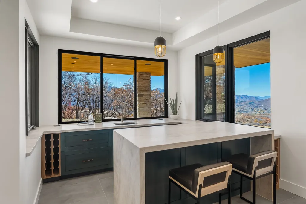2409 Preserve Drive Home in Park City, Utah. Discover this stunning 6-bedroom, 8-bathroom, 9,196 sq. ft. contemporary home in The Preserve, a premier gated community. Perched on 9.07 acres at the mountain's summit, the home offers breathtaking 280-degree views of ski areas, the Olympic Park, and Salt Lake City.