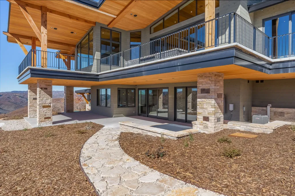 2409 Preserve Drive Home in Park City, Utah. Discover this stunning 6-bedroom, 8-bathroom, 9,196 sq. ft. contemporary home in The Preserve, a premier gated community. Perched on 9.07 acres at the mountain's summit, the home offers breathtaking 280-degree views of ski areas, the Olympic Park, and Salt Lake City.