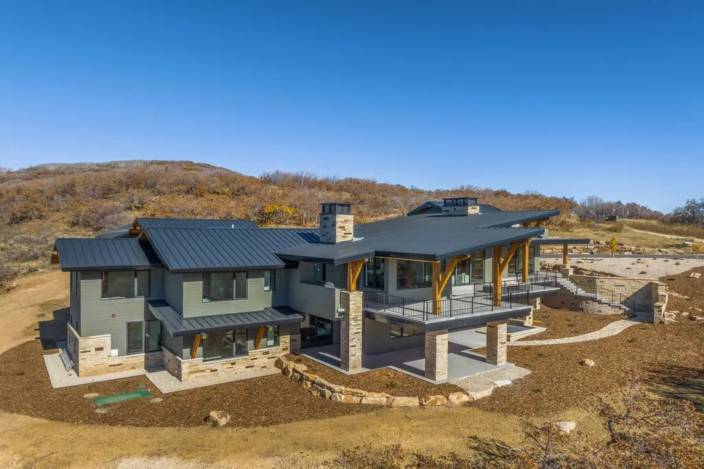 2409 Preserve Drive Home in Park City, Utah. Discover this stunning 6-bedroom, 8-bathroom, 9,196 sq. ft. contemporary home in The Preserve, a premier gated community. Perched on 9.07 acres at the mountain's summit, the home offers breathtaking 280-degree views of ski areas, the Olympic Park, and Salt Lake City.