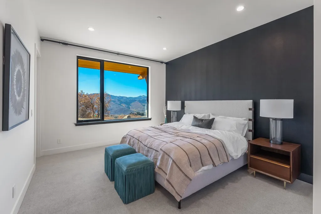 2409 Preserve Drive Home in Park City, Utah. Discover this stunning 6-bedroom, 8-bathroom, 9,196 sq. ft. contemporary home in The Preserve, a premier gated community. Perched on 9.07 acres at the mountain's summit, the home offers breathtaking 280-degree views of ski areas, the Olympic Park, and Salt Lake City.