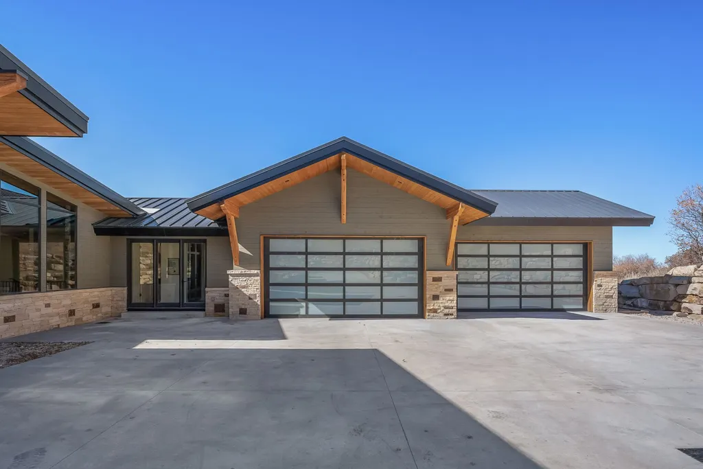 2409 Preserve Drive Home in Park City, Utah. Discover this stunning 6-bedroom, 8-bathroom, 9,196 sq. ft. contemporary home in The Preserve, a premier gated community. Perched on 9.07 acres at the mountain's summit, the home offers breathtaking 280-degree views of ski areas, the Olympic Park, and Salt Lake City.