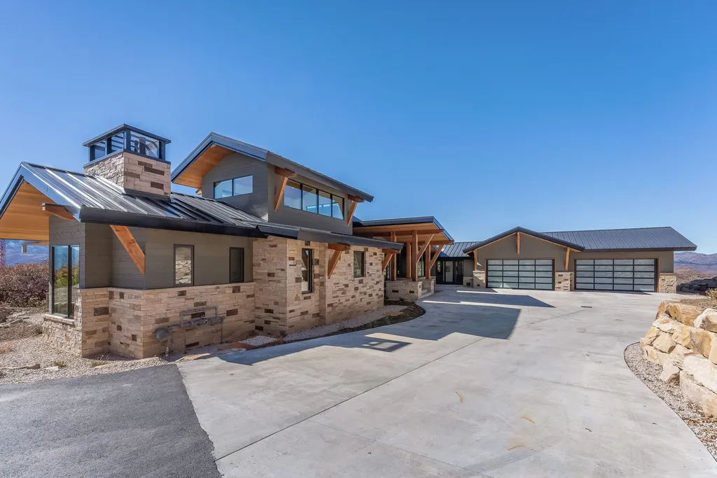 2409 Preserve Drive Home in Park City, Utah. Discover this stunning 6-bedroom, 8-bathroom, 9,196 sq. ft. contemporary home in The Preserve, a premier gated community. Perched on 9.07 acres at the mountain's summit, the home offers breathtaking 280-degree views of ski areas, the Olympic Park, and Salt Lake City.