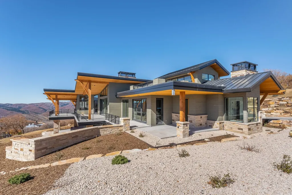 2409 Preserve Drive Home in Park City, Utah. Discover this stunning 6-bedroom, 8-bathroom, 9,196 sq. ft. contemporary home in The Preserve, a premier gated community. Perched on 9.07 acres at the mountain's summit, the home offers breathtaking 280-degree views of ski areas, the Olympic Park, and Salt Lake City.