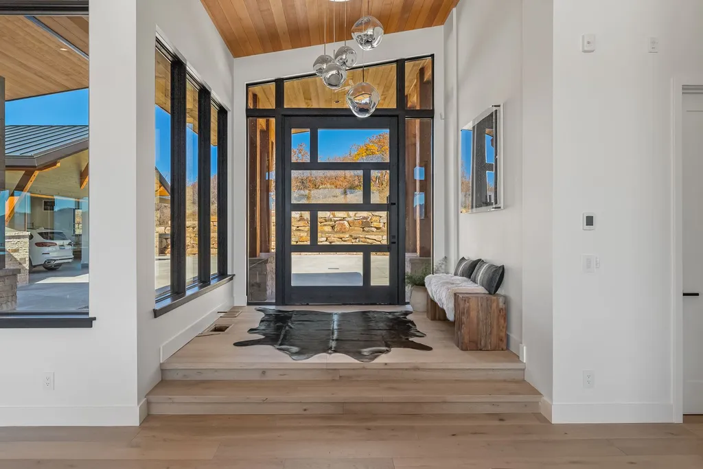 2409 Preserve Drive Home in Park City, Utah. Discover this stunning 6-bedroom, 8-bathroom, 9,196 sq. ft. contemporary home in The Preserve, a premier gated community. Perched on 9.07 acres at the mountain's summit, the home offers breathtaking 280-degree views of ski areas, the Olympic Park, and Salt Lake City.