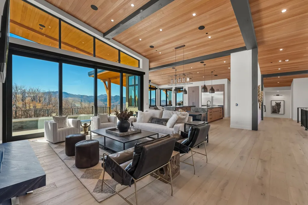 2409 Preserve Drive Home in Park City, Utah. Discover this stunning 6-bedroom, 8-bathroom, 9,196 sq. ft. contemporary home in The Preserve, a premier gated community. Perched on 9.07 acres at the mountain's summit, the home offers breathtaking 280-degree views of ski areas, the Olympic Park, and Salt Lake City.