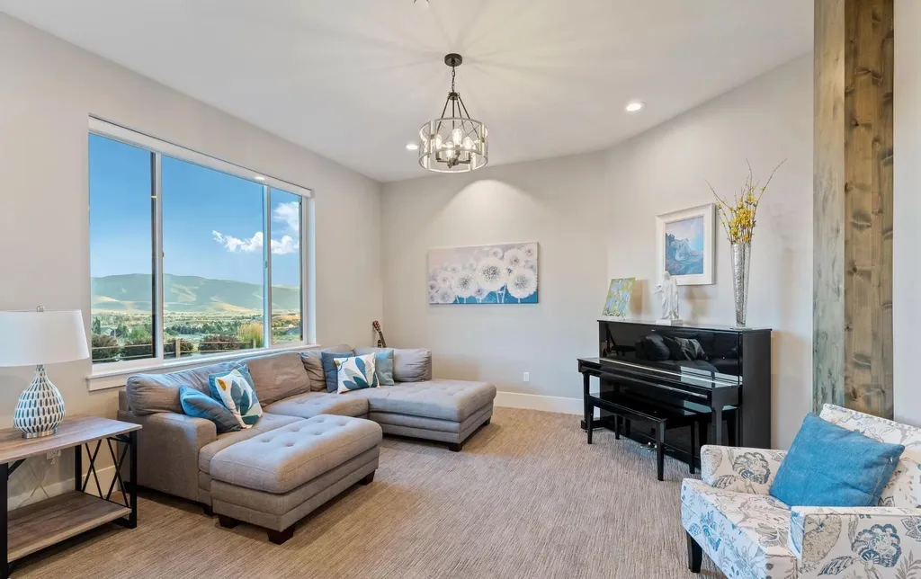 4115 Greener Hills Drive Home in Heber, Utah. Discover a 7.55-acre gated estate in Greener Hills. This luxury property features remarkable entertainment amenities, from exposed wood beams to a gourmet kitchen with Wolf appliances, an outdoor kitchen, pool, and firepit. The main level master offers radiant heat flooring, and the estate includes a playhouse, home theater, and more.