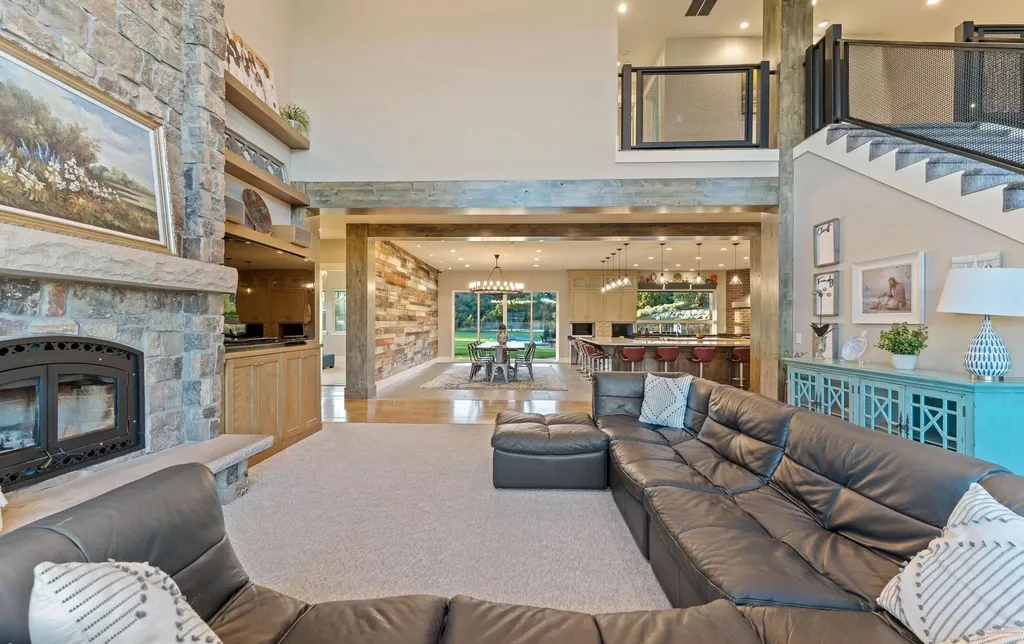 4115 Greener Hills Drive Home in Heber, Utah. Discover a 7.55-acre gated estate in Greener Hills. This luxury property features remarkable entertainment amenities, from exposed wood beams to a gourmet kitchen with Wolf appliances, an outdoor kitchen, pool, and firepit. The main level master offers radiant heat flooring, and the estate includes a playhouse, home theater, and more.