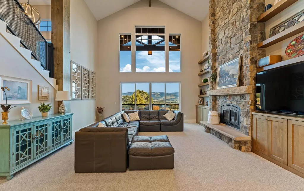 4115 Greener Hills Drive Home in Heber, Utah. Discover a 7.55-acre gated estate in Greener Hills. This luxury property features remarkable entertainment amenities, from exposed wood beams to a gourmet kitchen with Wolf appliances, an outdoor kitchen, pool, and firepit. The main level master offers radiant heat flooring, and the estate includes a playhouse, home theater, and more.