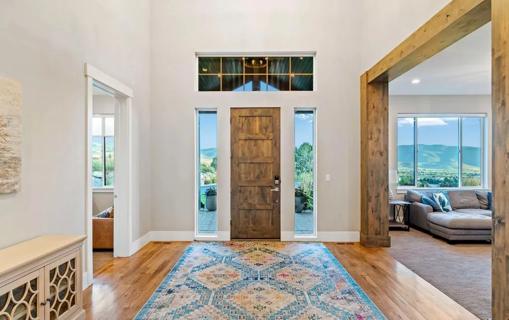 4115 Greener Hills Drive Home in Heber, Utah. Discover a 7.55-acre gated estate in Greener Hills. This luxury property features remarkable entertainment amenities, from exposed wood beams to a gourmet kitchen with Wolf appliances, an outdoor kitchen, pool, and firepit. The main level master offers radiant heat flooring, and the estate includes a playhouse, home theater, and more.