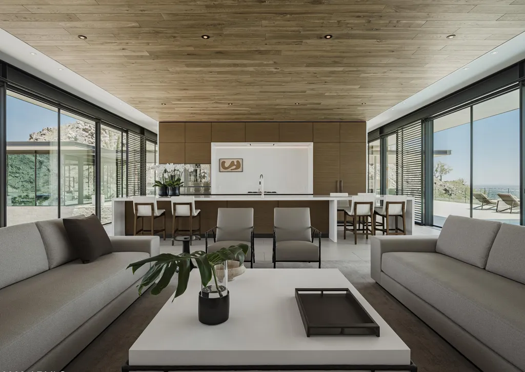 4301 E Upper Ridge Way Home in Paradise Valley, Arizona. Perched between two mountain peaks, the Upper Ridge Residence is an 8,000+ sf modern marvel designed by The Construction Zone. Featuring panoramic Valley of the Sun views, this steel and glass pavilion offers the highest level of craftsmanship.