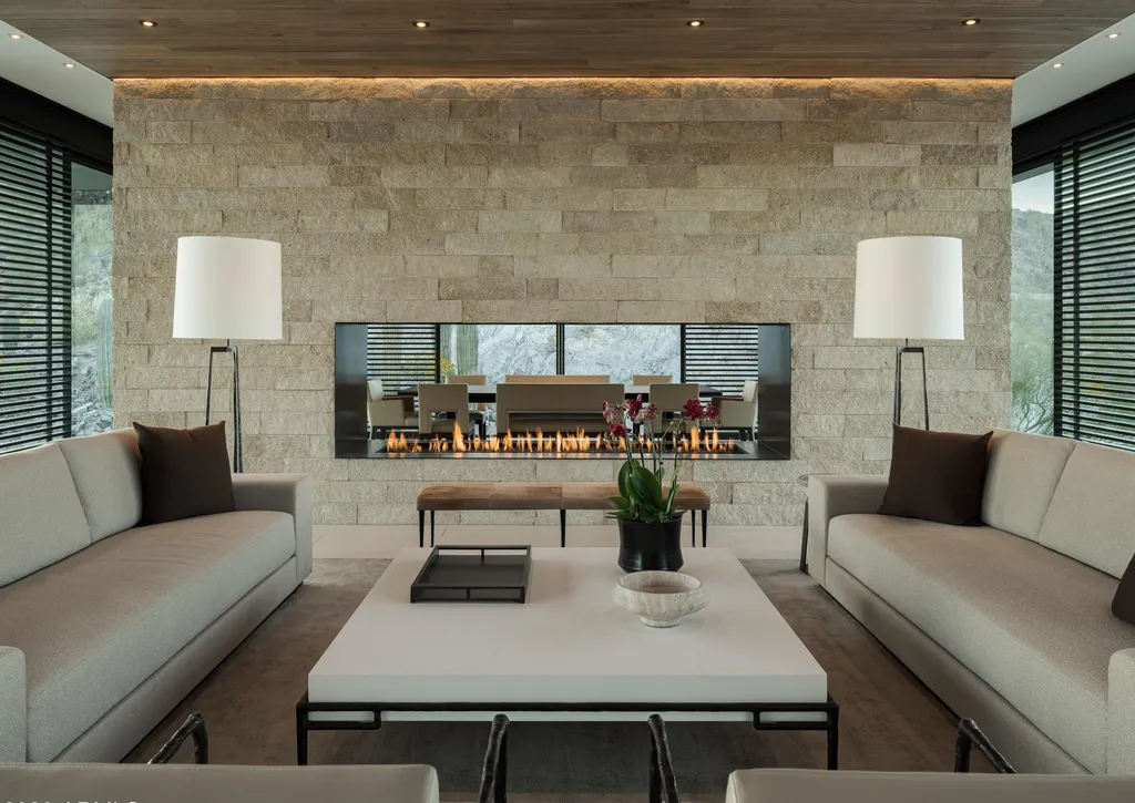 4301 E Upper Ridge Way Home in Paradise Valley, Arizona. Perched between two mountain peaks, the Upper Ridge Residence is an 8,000+ sf modern marvel designed by The Construction Zone. Featuring panoramic Valley of the Sun views, this steel and glass pavilion offers the highest level of craftsmanship.
