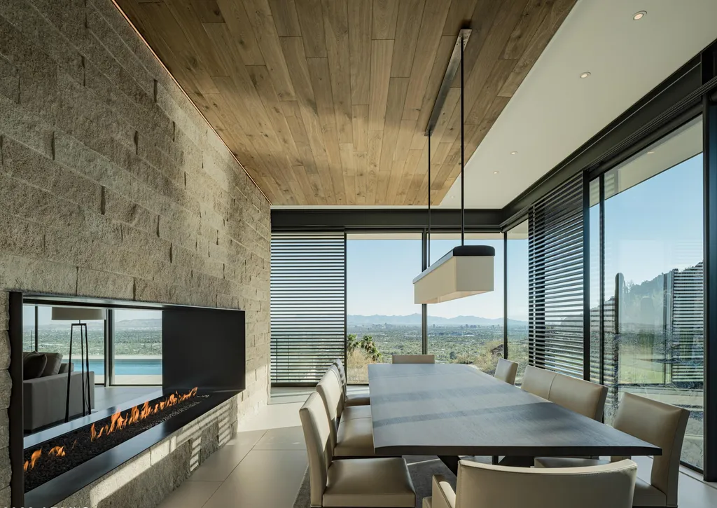 4301 E Upper Ridge Way Home in Paradise Valley, Arizona. Perched between two mountain peaks, the Upper Ridge Residence is an 8,000+ sf modern marvel designed by The Construction Zone. Featuring panoramic Valley of the Sun views, this steel and glass pavilion offers the highest level of craftsmanship.