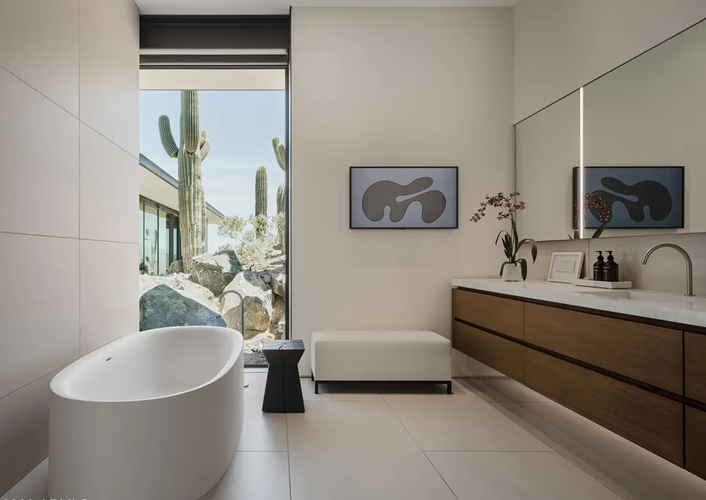 4301 E Upper Ridge Way Home in Paradise Valley, Arizona. Perched between two mountain peaks, the Upper Ridge Residence is an 8,000+ sf modern marvel designed by The Construction Zone. Featuring panoramic Valley of the Sun views, this steel and glass pavilion offers the highest level of craftsmanship.