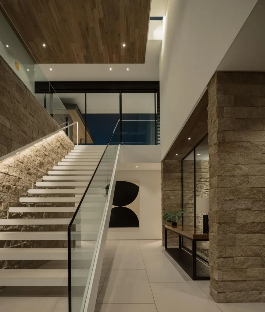 4301 E Upper Ridge Way Home in Paradise Valley, Arizona. Perched between two mountain peaks, the Upper Ridge Residence is an 8,000+ sf modern marvel designed by The Construction Zone. Featuring panoramic Valley of the Sun views, this steel and glass pavilion offers the highest level of craftsmanship.