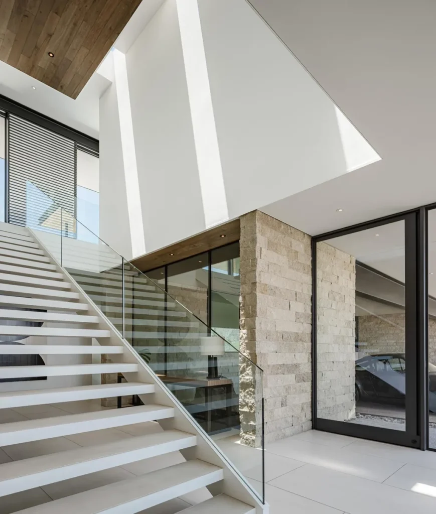 4301 E Upper Ridge Way Home in Paradise Valley, Arizona. Perched between two mountain peaks, the Upper Ridge Residence is an 8,000+ sf modern marvel designed by The Construction Zone. Featuring panoramic Valley of the Sun views, this steel and glass pavilion offers the highest level of craftsmanship.