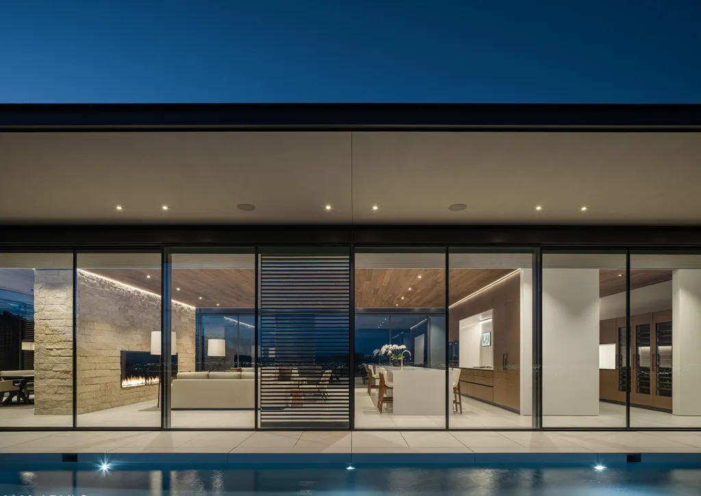 4301 E Upper Ridge Way Home in Paradise Valley, Arizona. Perched between two mountain peaks, the Upper Ridge Residence is an 8,000+ sf modern marvel designed by The Construction Zone. Featuring panoramic Valley of the Sun views, this steel and glass pavilion offers the highest level of craftsmanship.