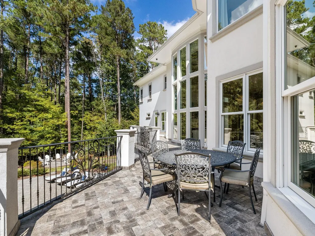 53 Topaz Jewel Court Home in Durham, North Carolina. Step into an extraordinary opportunity to own an ultra-luxury home in a coveted, fully fenced, and gated community, nestled within 5+ pristine acres. This magnificent estate represents the epitome of elegance and sophistication, boasting superior craftsmanship and unparalleled attention to detail at every turn.