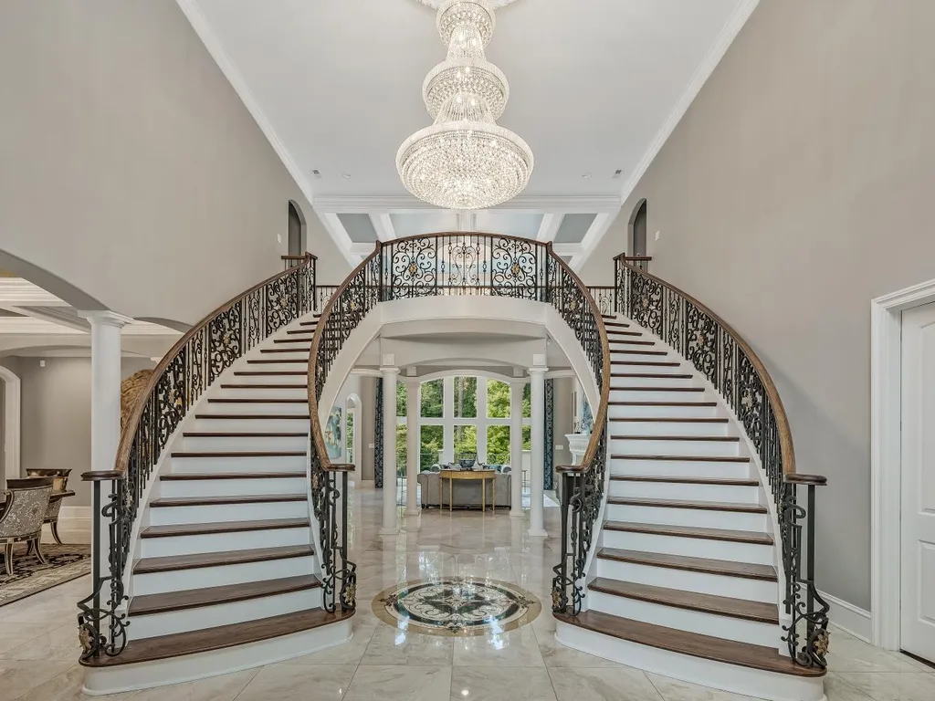 53 Topaz Jewel Court Home in Durham, North Carolina. Step into an extraordinary opportunity to own an ultra-luxury home in a coveted, fully fenced, and gated community, nestled within 5+ pristine acres. This magnificent estate represents the epitome of elegance and sophistication, boasting superior craftsmanship and unparalleled attention to detail at every turn.