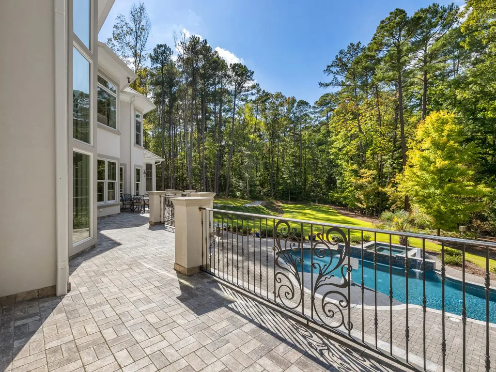 53 Topaz Jewel Court Home in Durham, North Carolina. Step into an extraordinary opportunity to own an ultra-luxury home in a coveted, fully fenced, and gated community, nestled within 5+ pristine acres. This magnificent estate represents the epitome of elegance and sophistication, boasting superior craftsmanship and unparalleled attention to detail at every turn.