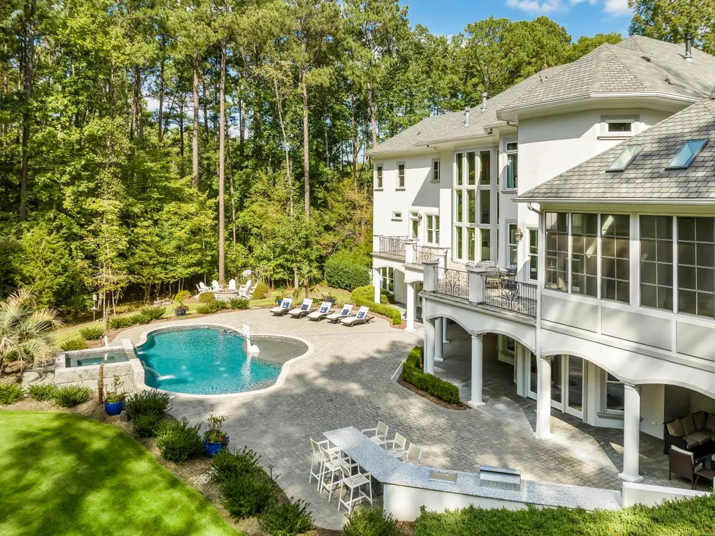 53 Topaz Jewel Court Home in Durham, North Carolina. Step into an extraordinary opportunity to own an ultra-luxury home in a coveted, fully fenced, and gated community, nestled within 5+ pristine acres. This magnificent estate represents the epitome of elegance and sophistication, boasting superior craftsmanship and unparalleled attention to detail at every turn.