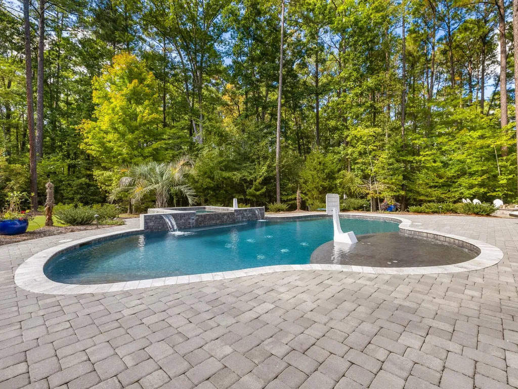 53 Topaz Jewel Court Home in Durham, North Carolina. Step into an extraordinary opportunity to own an ultra-luxury home in a coveted, fully fenced, and gated community, nestled within 5+ pristine acres. This magnificent estate represents the epitome of elegance and sophistication, boasting superior craftsmanship and unparalleled attention to detail at every turn.