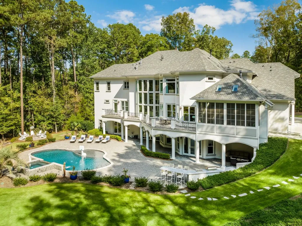 53 Topaz Jewel Court Home in Durham, North Carolina. Step into an extraordinary opportunity to own an ultra-luxury home in a coveted, fully fenced, and gated community, nestled within 5+ pristine acres. This magnificent estate represents the epitome of elegance and sophistication, boasting superior craftsmanship and unparalleled attention to detail at every turn.