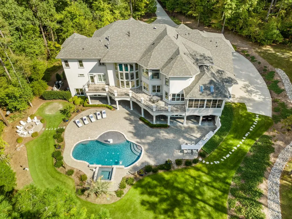 53 Topaz Jewel Court Home in Durham, North Carolina. Step into an extraordinary opportunity to own an ultra-luxury home in a coveted, fully fenced, and gated community, nestled within 5+ pristine acres. This magnificent estate represents the epitome of elegance and sophistication, boasting superior craftsmanship and unparalleled attention to detail at every turn.