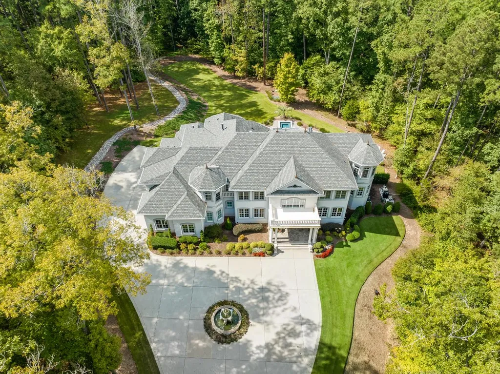 53 Topaz Jewel Court Home in Durham, North Carolina. Step into an extraordinary opportunity to own an ultra-luxury home in a coveted, fully fenced, and gated community, nestled within 5+ pristine acres. This magnificent estate represents the epitome of elegance and sophistication, boasting superior craftsmanship and unparalleled attention to detail at every turn.