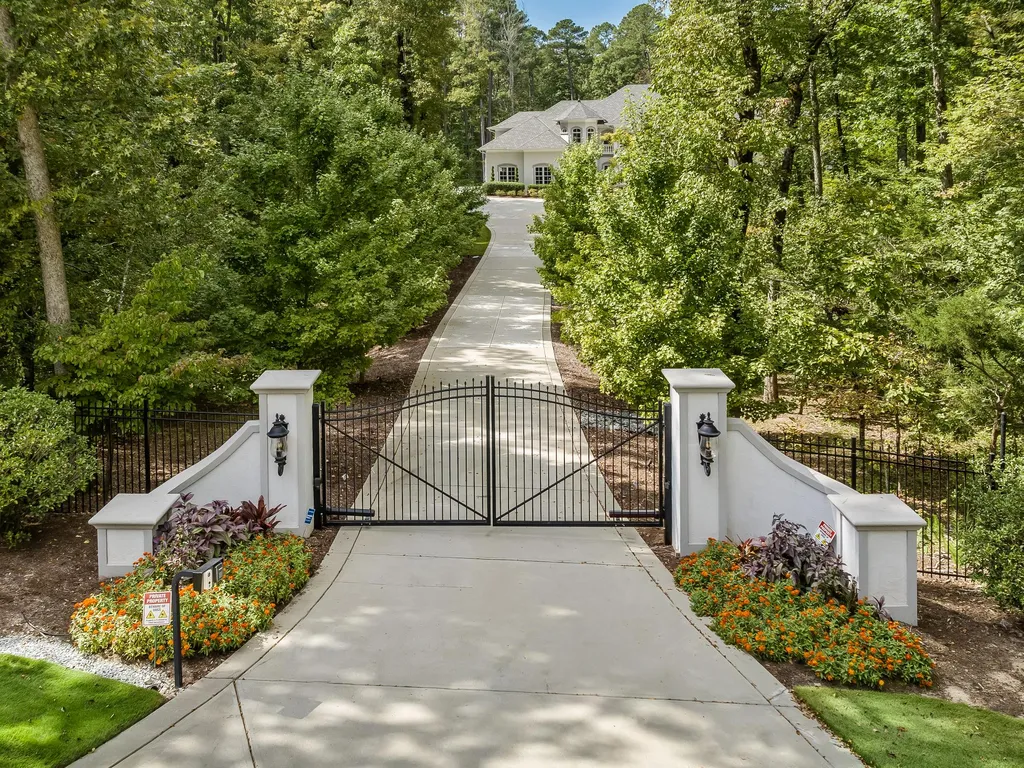 53 Topaz Jewel Court Home in Durham, North Carolina. Step into an extraordinary opportunity to own an ultra-luxury home in a coveted, fully fenced, and gated community, nestled within 5+ pristine acres. This magnificent estate represents the epitome of elegance and sophistication, boasting superior craftsmanship and unparalleled attention to detail at every turn.