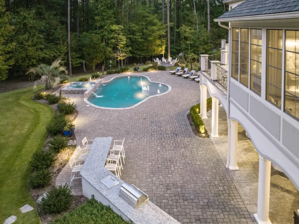 53 Topaz Jewel Court Home in Durham, North Carolina. Step into an extraordinary opportunity to own an ultra-luxury home in a coveted, fully fenced, and gated community, nestled within 5+ pristine acres. This magnificent estate represents the epitome of elegance and sophistication, boasting superior craftsmanship and unparalleled attention to detail at every turn.