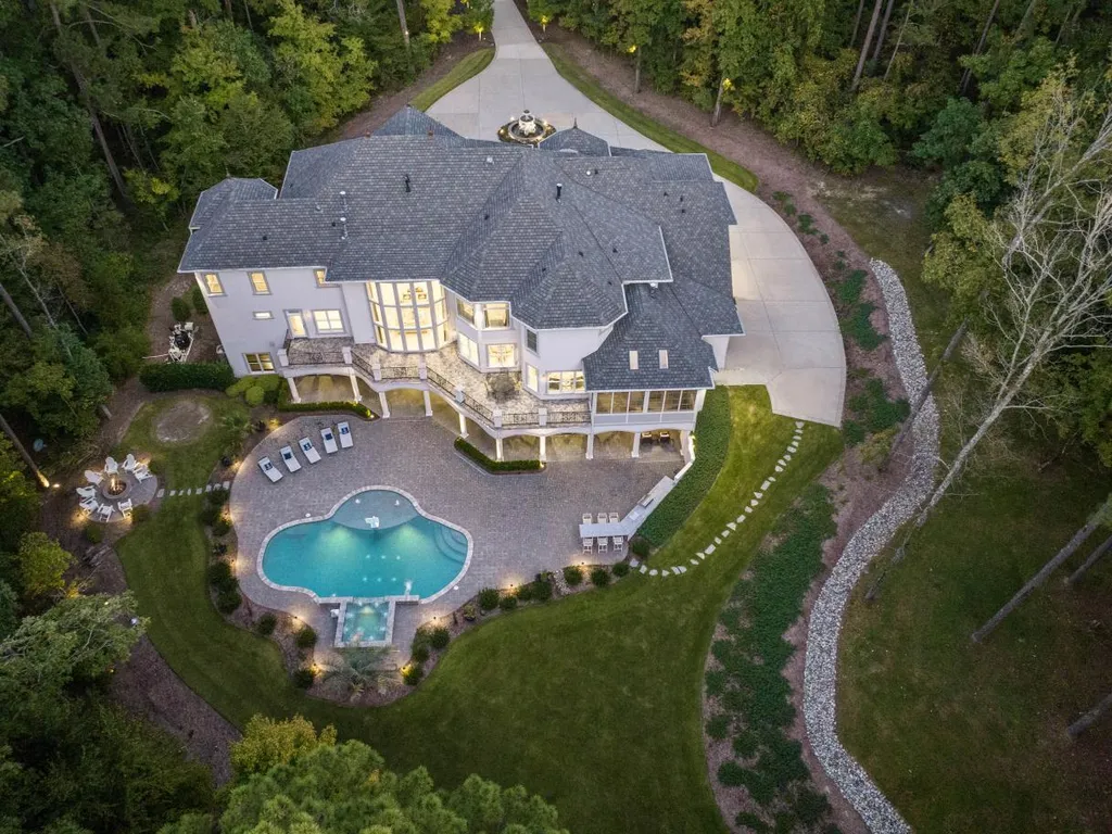 53 Topaz Jewel Court Home in Durham, North Carolina. Step into an extraordinary opportunity to own an ultra-luxury home in a coveted, fully fenced, and gated community, nestled within 5+ pristine acres. This magnificent estate represents the epitome of elegance and sophistication, boasting superior craftsmanship and unparalleled attention to detail at every turn.