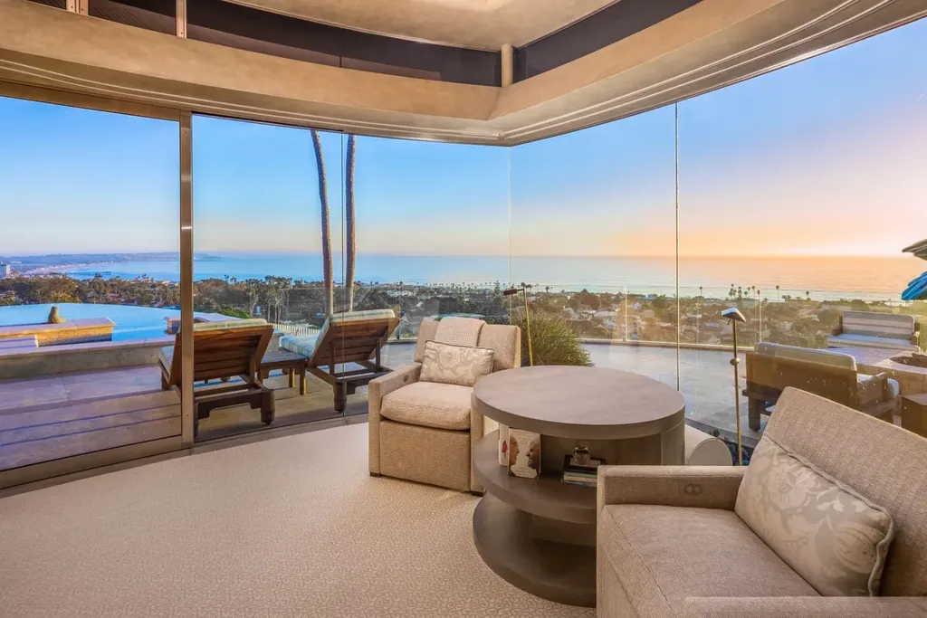 5740 La Jolla Corona Drive Home in La Jolla, California. Discover SEAVIEW, a stunning 5-bedroom architectural marvel in San Diego that offers an extraordinary 260-degree panorama of the ocean. This 8,810 sq ft estate, designed by Island Architects and constructed by Wardell Builders, exudes opulence with its saltwater infinity pool, fresh-water ponds, and lavish interiors. 