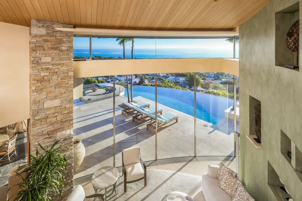 5740 La Jolla Corona Drive Home in La Jolla, California. Discover SEAVIEW, a stunning 5-bedroom architectural marvel in San Diego that offers an extraordinary 260-degree panorama of the ocean. This 8,810 sq ft estate, designed by Island Architects and constructed by Wardell Builders, exudes opulence with its saltwater infinity pool, fresh-water ponds, and lavish interiors. 