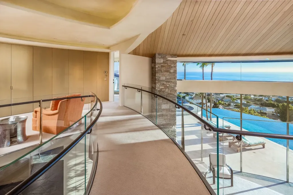 5740 La Jolla Corona Drive Home in La Jolla, California. Discover SEAVIEW, a stunning 5-bedroom architectural marvel in San Diego that offers an extraordinary 260-degree panorama of the ocean. This 8,810 sq ft estate, designed by Island Architects and constructed by Wardell Builders, exudes opulence with its saltwater infinity pool, fresh-water ponds, and lavish interiors. 