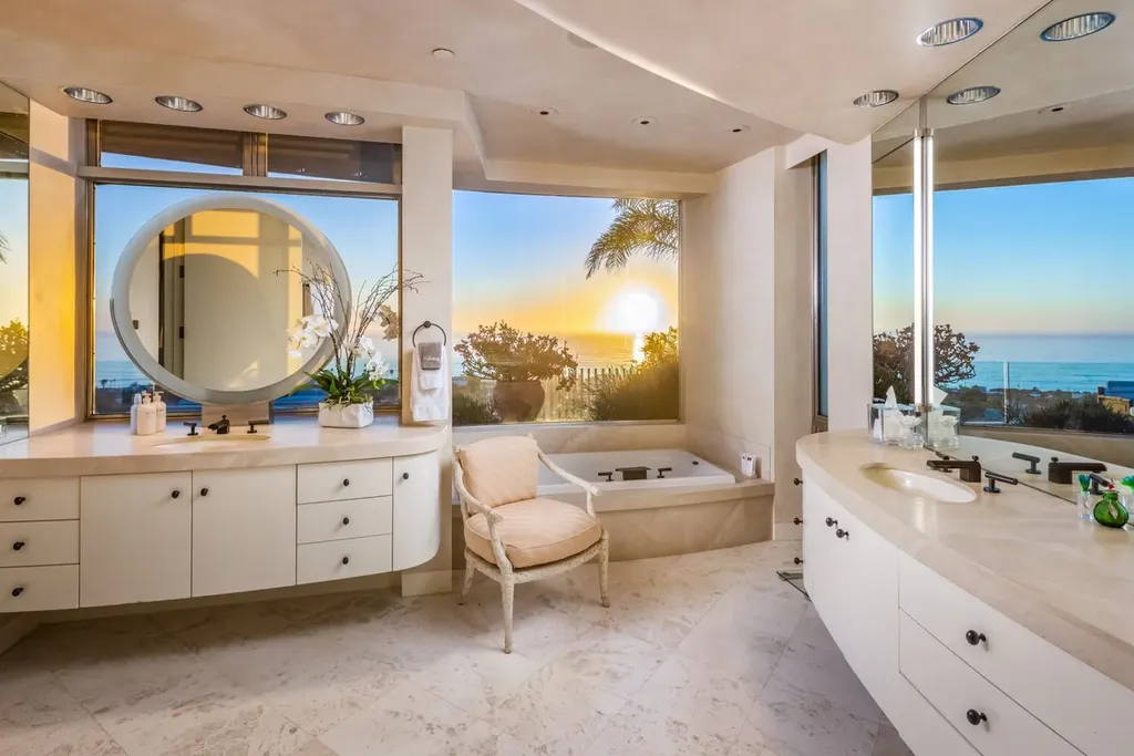 5740 La Jolla Corona Drive Home in La Jolla, California. Discover SEAVIEW, a stunning 5-bedroom architectural marvel in San Diego that offers an extraordinary 260-degree panorama of the ocean. This 8,810 sq ft estate, designed by Island Architects and constructed by Wardell Builders, exudes opulence with its saltwater infinity pool, fresh-water ponds, and lavish interiors. 