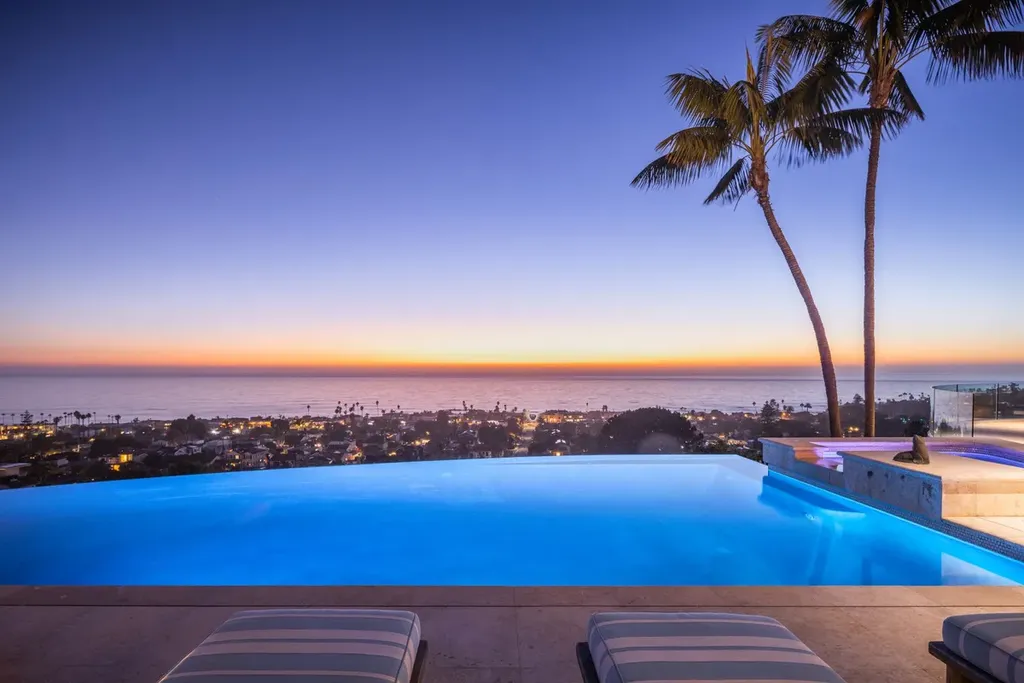 5740 La Jolla Corona Drive Home in La Jolla, California. Discover SEAVIEW, a stunning 5-bedroom architectural marvel in San Diego that offers an extraordinary 260-degree panorama of the ocean. This 8,810 sq ft estate, designed by Island Architects and constructed by Wardell Builders, exudes opulence with its saltwater infinity pool, fresh-water ponds, and lavish interiors. 
