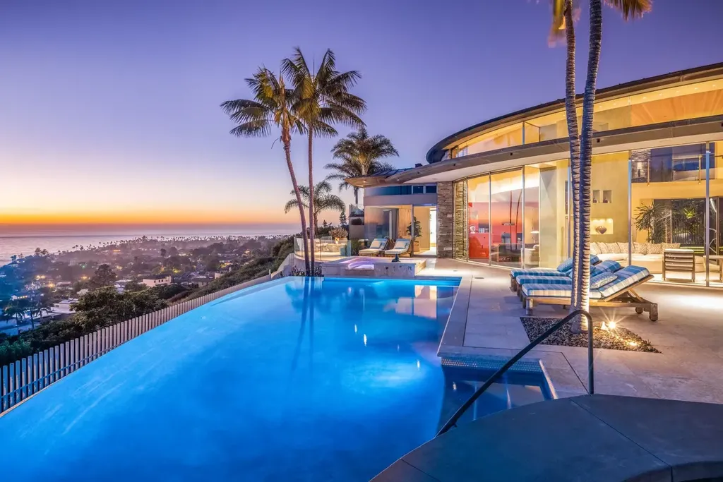 5740 La Jolla Corona Drive Home in La Jolla, California. Discover SEAVIEW, a stunning 5-bedroom architectural marvel in San Diego that offers an extraordinary 260-degree panorama of the ocean. This 8,810 sq ft estate, designed by Island Architects and constructed by Wardell Builders, exudes opulence with its saltwater infinity pool, fresh-water ponds, and lavish interiors. 