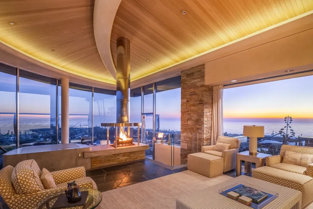 5740 La Jolla Corona Drive Home in La Jolla, California. Discover SEAVIEW, a stunning 5-bedroom architectural marvel in San Diego that offers an extraordinary 260-degree panorama of the ocean. This 8,810 sq ft estate, designed by Island Architects and constructed by Wardell Builders, exudes opulence with its saltwater infinity pool, fresh-water ponds, and lavish interiors. 