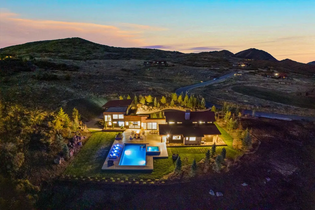 5930 N Triple Crown Trail Home in Oakley, Utah. NorthStar Ranch is a breathtaking mountain contemporary home nestled on over eight acres of serene landscape in Summit County. With two main floor primary suites, a six-car garage, and stunning views of Mt. Timpanogos and Park City ski resorts, this property offers a perfect blend of luxury and natural beauty.