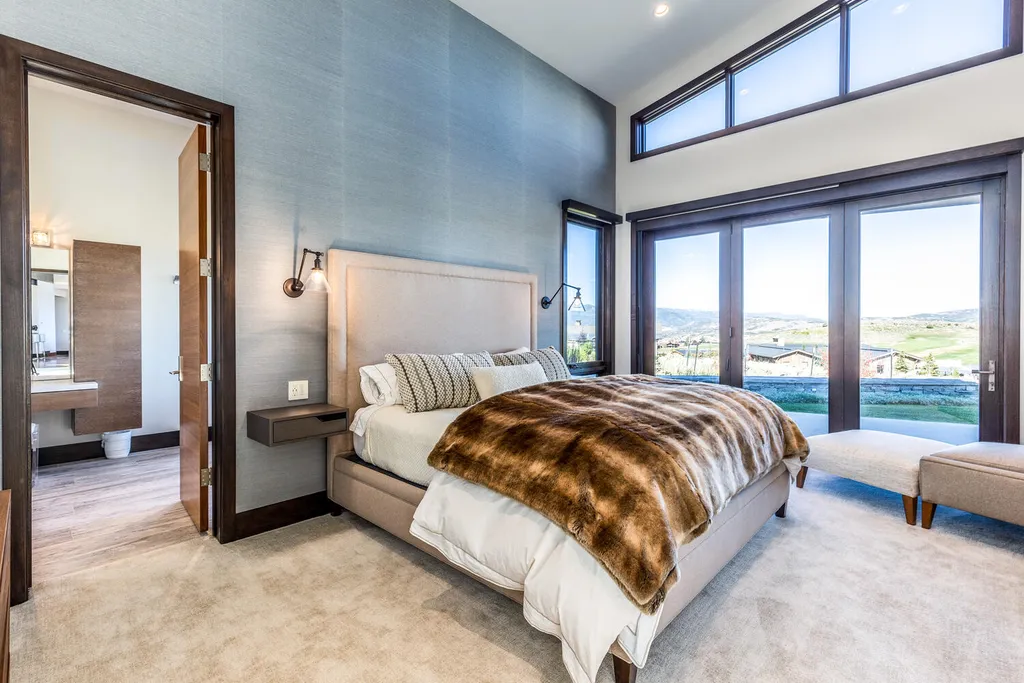 7235 North Starlight Circle Home in Kamas, Utah. Experience ultimate luxury living in this exceptional 5-bedroom, 5 ½-bathroom masterpiece spanning 6,270 square feet. Embrace the outdoors with folding glass doors leading to a heated patio, infinity spa pool, and landscaped yard with stunning Deer Valley and Jordanelle Reservoir views.