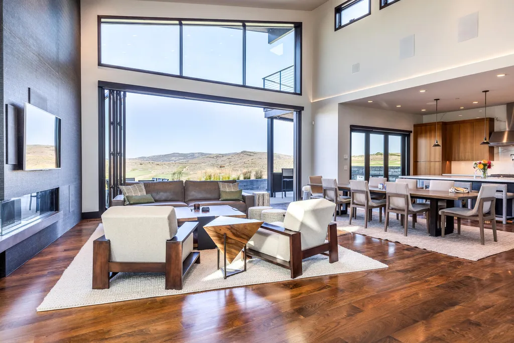 7235 North Starlight Circle Home in Kamas, Utah. Experience ultimate luxury living in this exceptional 5-bedroom, 5 ½-bathroom masterpiece spanning 6,270 square feet. Embrace the outdoors with folding glass doors leading to a heated patio, infinity spa pool, and landscaped yard with stunning Deer Valley and Jordanelle Reservoir views.
