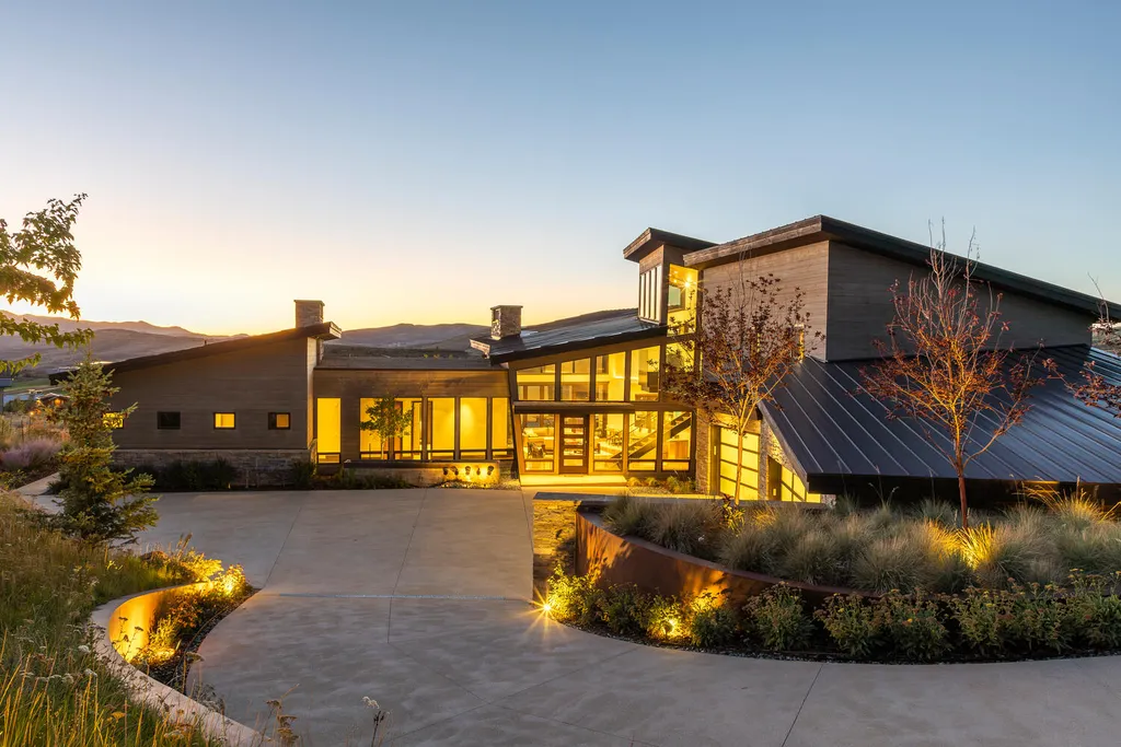 7235 North Starlight Circle Home in Kamas, Utah. Experience ultimate luxury living in this exceptional 5-bedroom, 5 ½-bathroom masterpiece spanning 6,270 square feet. Embrace the outdoors with folding glass doors leading to a heated patio, infinity spa pool, and landscaped yard with stunning Deer Valley and Jordanelle Reservoir views.