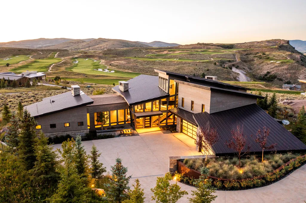 7235 North Starlight Circle Home in Kamas, Utah. Experience ultimate luxury living in this exceptional 5-bedroom, 5 ½-bathroom masterpiece spanning 6,270 square feet. Embrace the outdoors with folding glass doors leading to a heated patio, infinity spa pool, and landscaped yard with stunning Deer Valley and Jordanelle Reservoir views.