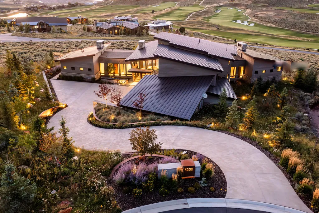 7235 North Starlight Circle Home in Kamas, Utah. Experience ultimate luxury living in this exceptional 5-bedroom, 5 ½-bathroom masterpiece spanning 6,270 square feet. Embrace the outdoors with folding glass doors leading to a heated patio, infinity spa pool, and landscaped yard with stunning Deer Valley and Jordanelle Reservoir views.