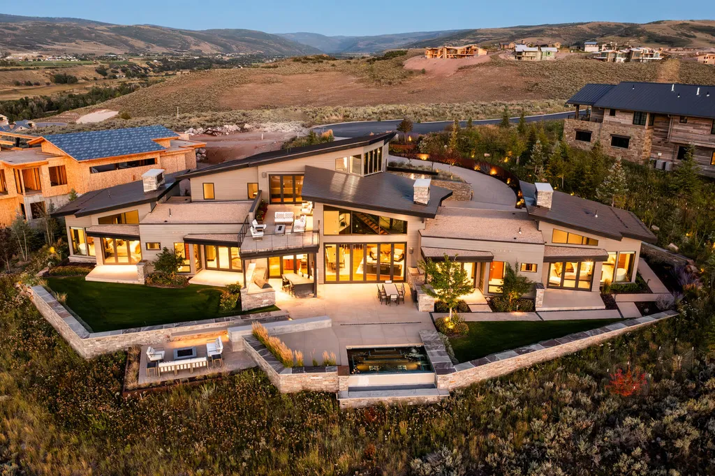 7235 North Starlight Circle Home in Kamas, Utah. Experience ultimate luxury living in this exceptional 5-bedroom, 5 ½-bathroom masterpiece spanning 6,270 square feet. Embrace the outdoors with folding glass doors leading to a heated patio, infinity spa pool, and landscaped yard with stunning Deer Valley and Jordanelle Reservoir views.