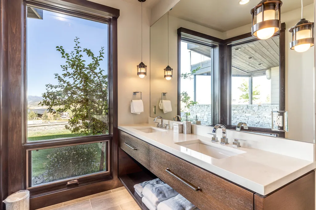 7235 North Starlight Circle Home in Kamas, Utah. Experience ultimate luxury living in this exceptional 5-bedroom, 5 ½-bathroom masterpiece spanning 6,270 square feet. Embrace the outdoors with folding glass doors leading to a heated patio, infinity spa pool, and landscaped yard with stunning Deer Valley and Jordanelle Reservoir views.