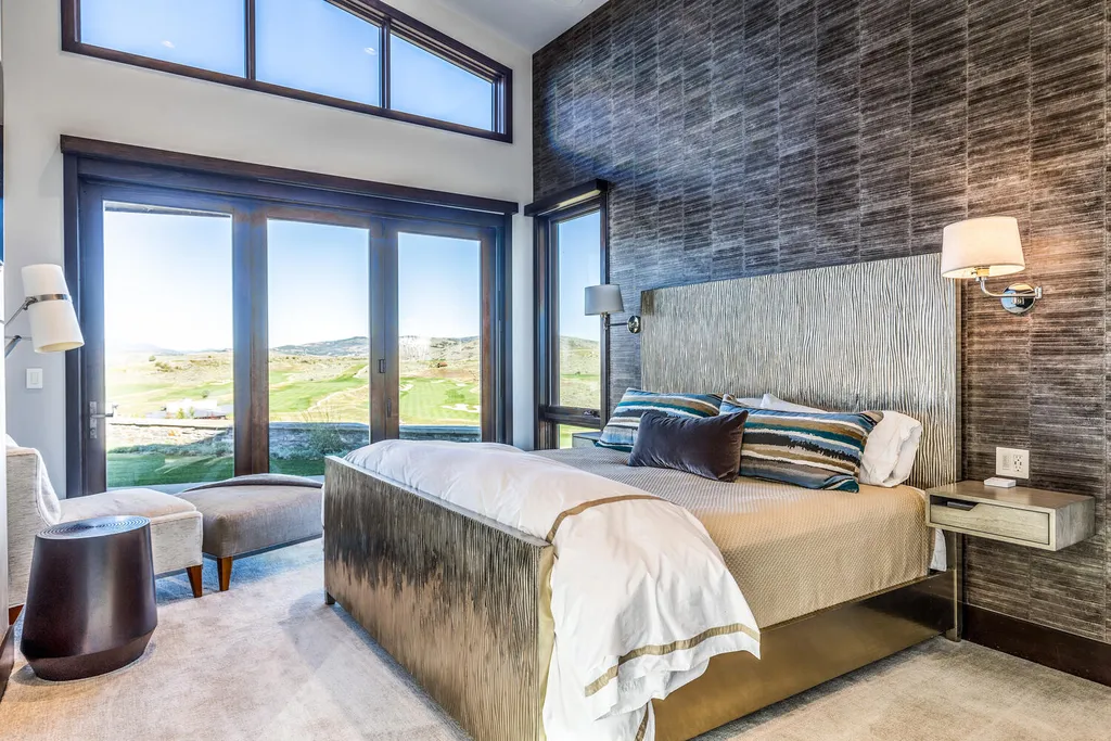 7235 North Starlight Circle Home in Kamas, Utah. Experience ultimate luxury living in this exceptional 5-bedroom, 5 ½-bathroom masterpiece spanning 6,270 square feet. Embrace the outdoors with folding glass doors leading to a heated patio, infinity spa pool, and landscaped yard with stunning Deer Valley and Jordanelle Reservoir views.